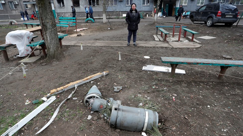Remains of a missile on the ground near an apartment building in Mariupol