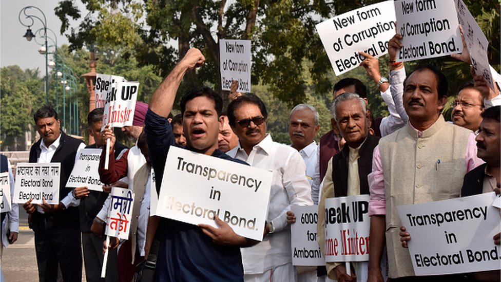 Congress MPs protest against the issue of electoral bonds in the Parliament premises during the Winter Session, demanding that Prime Minister Narendra Modi breaks his silence over it, on November 22, 2019 in New Delhi, India.