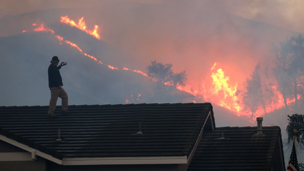 CHINO HILLS, CA - OCTOBER 27: Herman Termeer (cq) watches the brushfire at Chino Hills State Park from the roof of his house on Tuesday, Oct. 27, 2020 in Chino Hills, CA. (Photo by Myung J. Chun/Los Angeles Times via Getty Images)