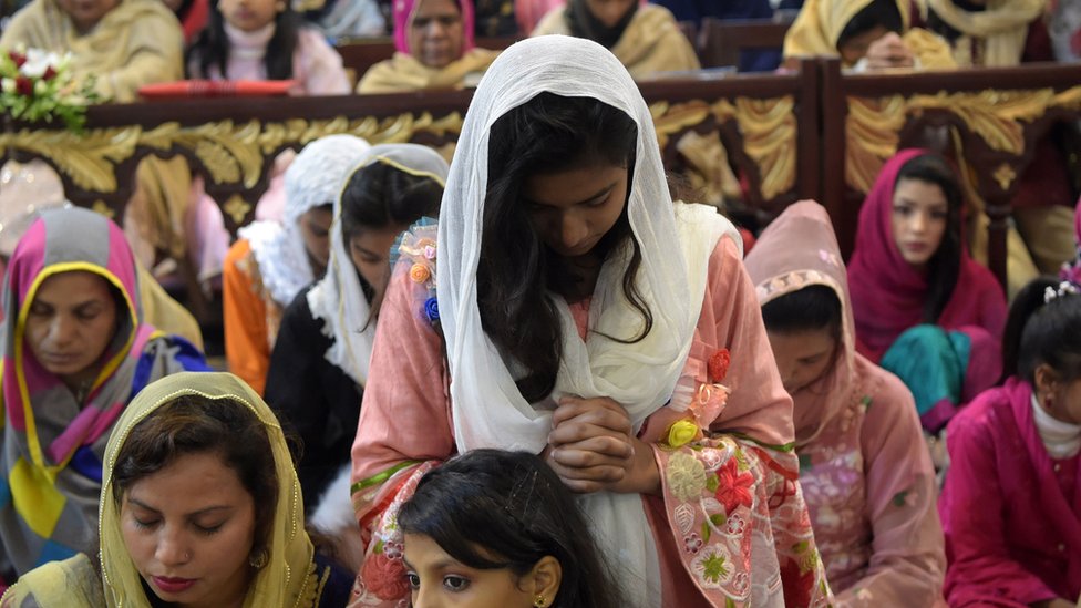 Christian devotees attend Christmas Day prayers at St. Johns Cathedral Church in Peshawar
