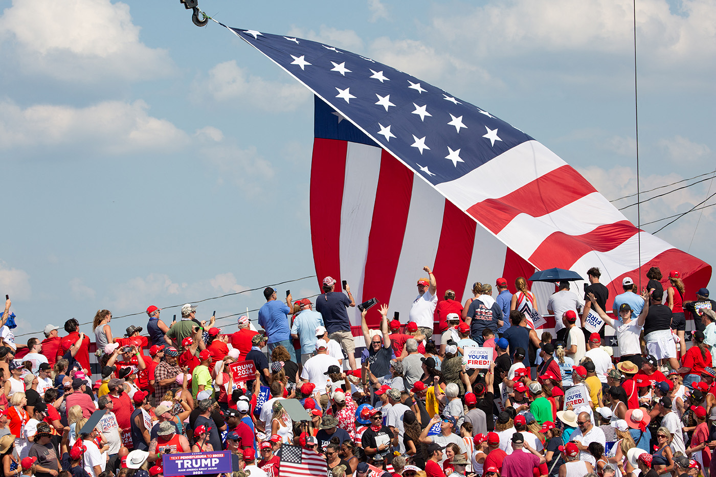 US flag flies over supporters at Trump rally in Butler