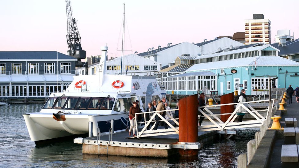 Passengers disembarking the East by West Ferry in Wellington, the capital of New Zealand.