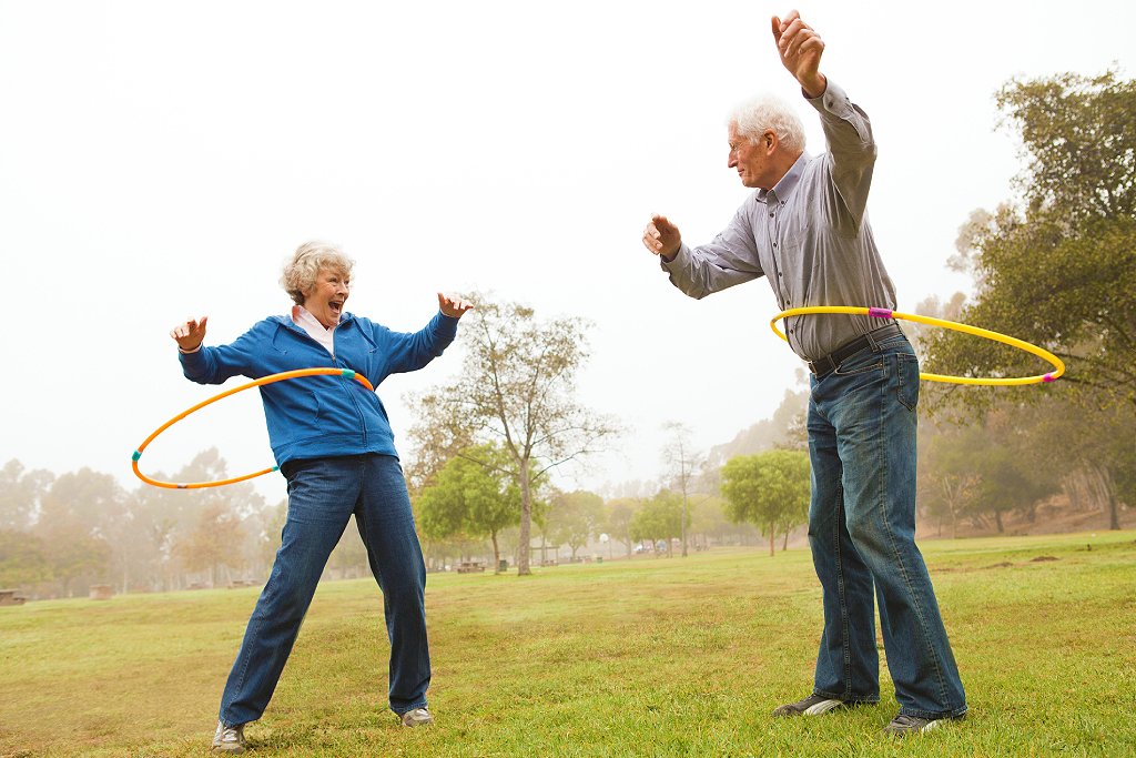 Mature couple playing in the park