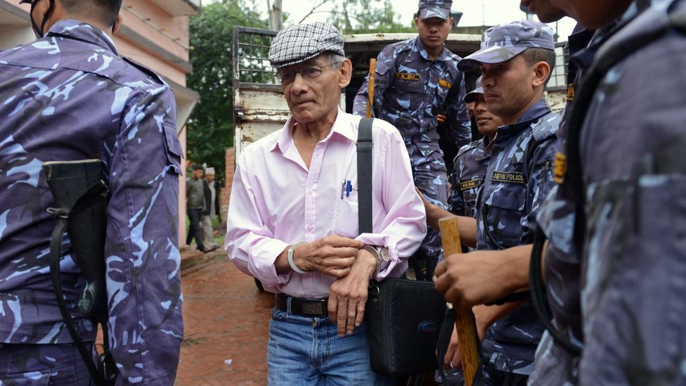 Charles Sobhraj being taken to a court for a hearing
