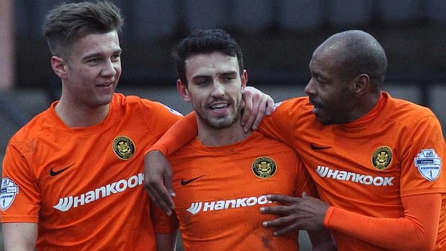 Carrick Rangers players celebrate a 2-1 victory over Coleraine