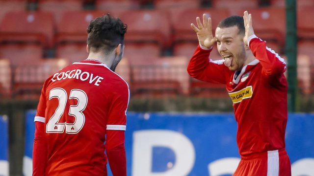 Tomas Cosgrove celebrates with team-mate Martin Donnelly as Cliftonville beat Dungannon Swifts