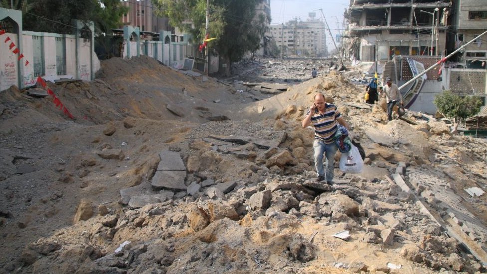 Palestinian citizens evacuate their homes damaged by Israeli airstrikes on October 10, 2023 in Gaza City, Gaza