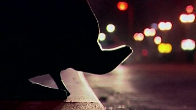 Prostitute's high-heel shoe on curb