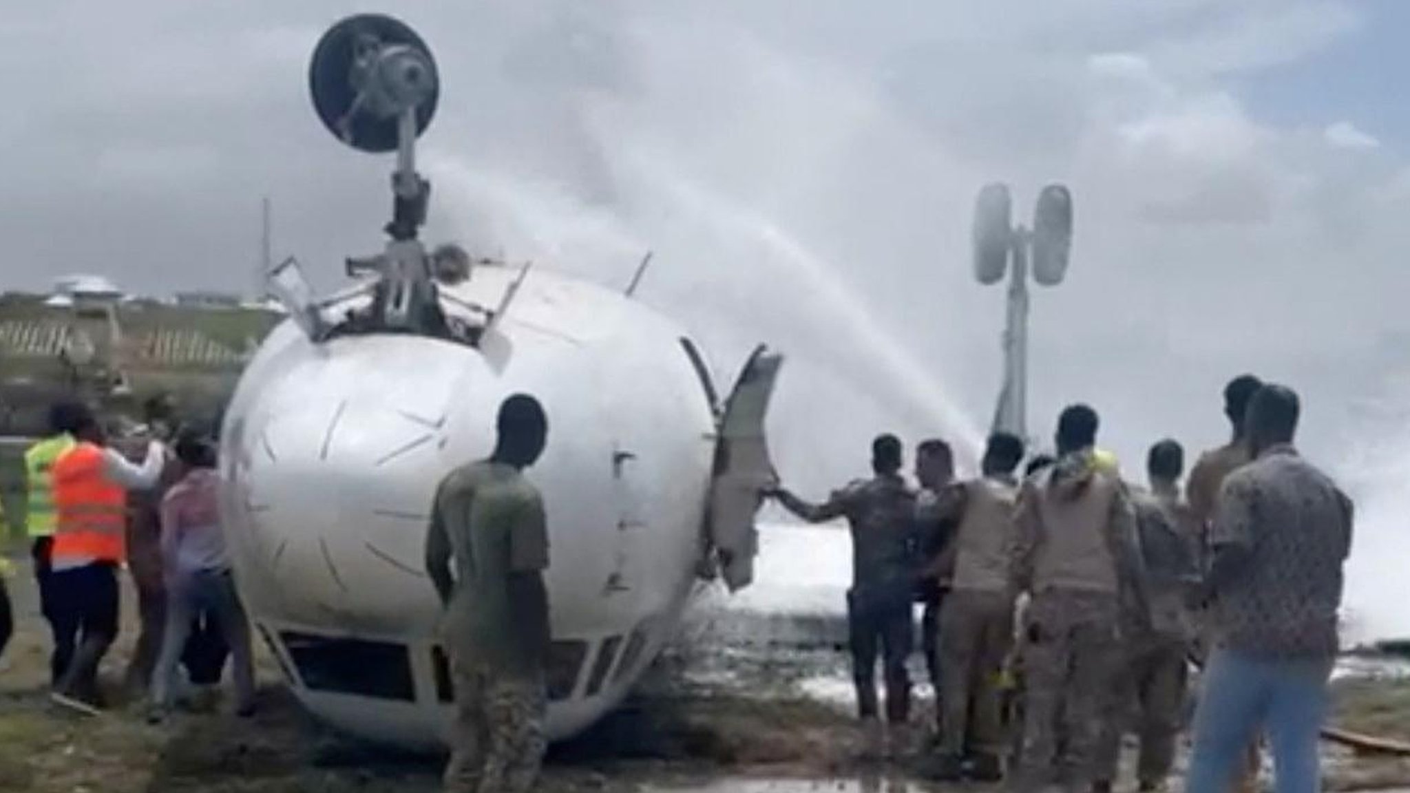 Somalia plane crash Plane flips over at Mogadishu airport pic