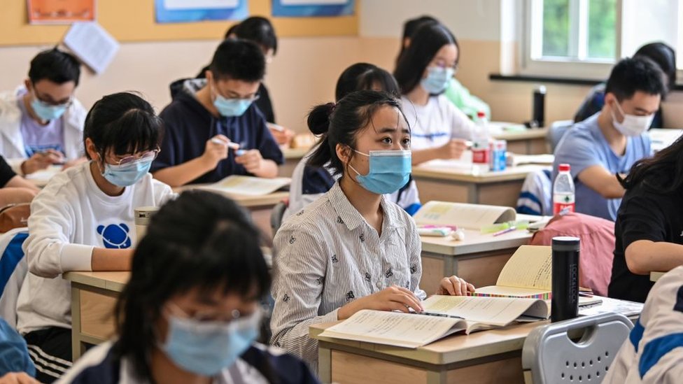 Students pictured in a classroom wearing masks in Shanghai in 2020