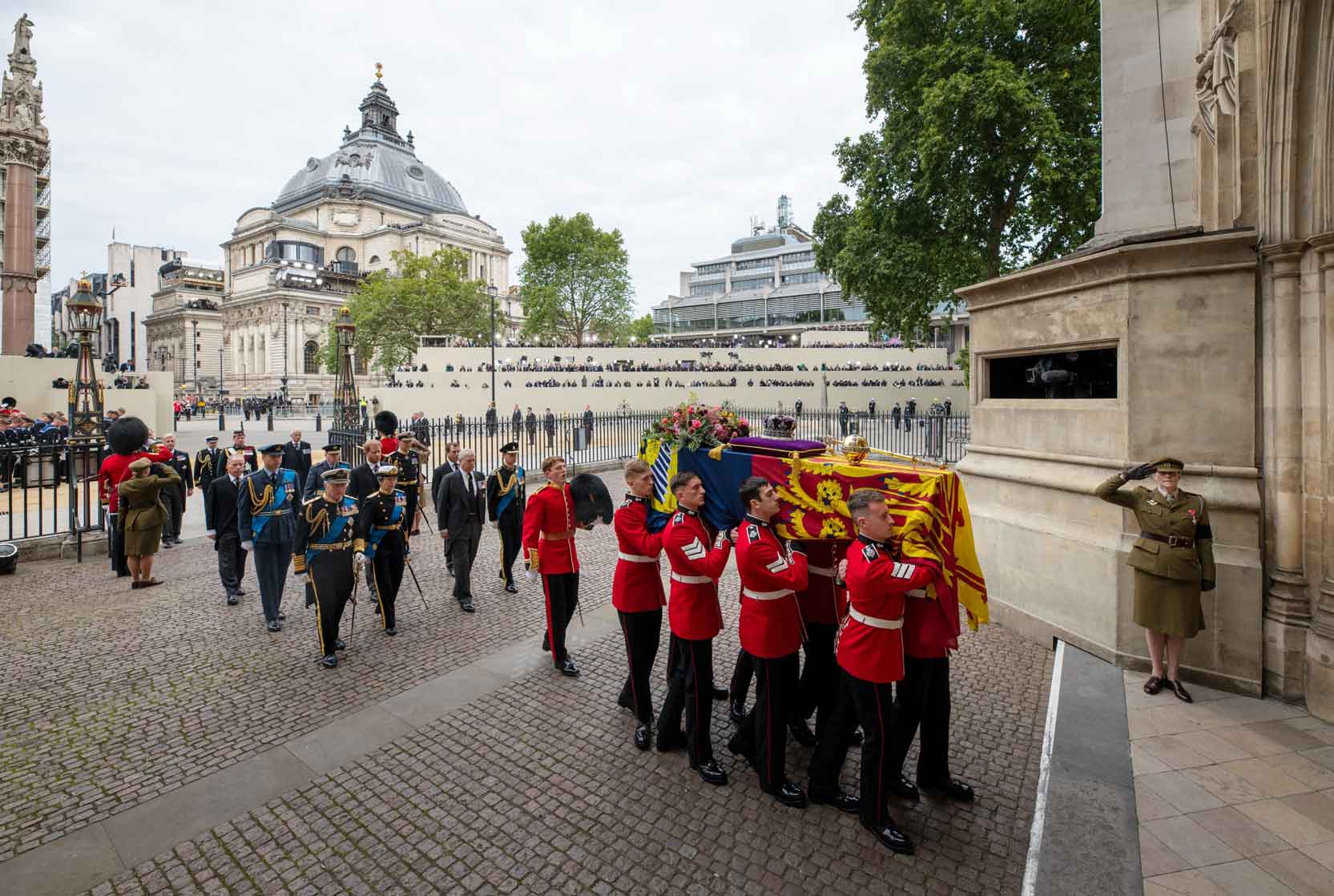 The Queen's coffin is carried into Westminster Abbey.