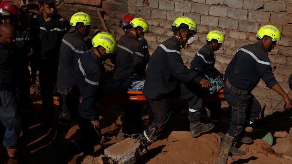 Rescue workers recover one body from the rubble, in the aftermath of a deadly earthquake in Ouirgane, Morocco, September 10, 2023