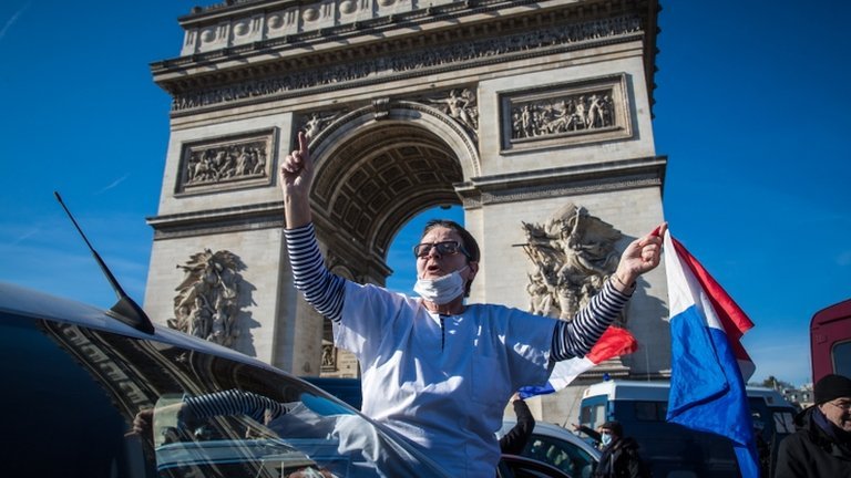 French police fire tear gas at demonstrators as anti-restriction convoy  enters Paris