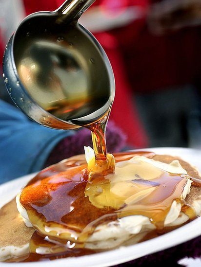 A pancake with maple syrup.