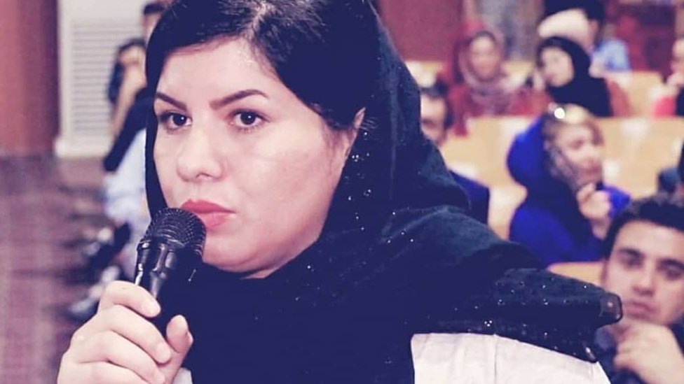 Firooza Omar speaking at a conference