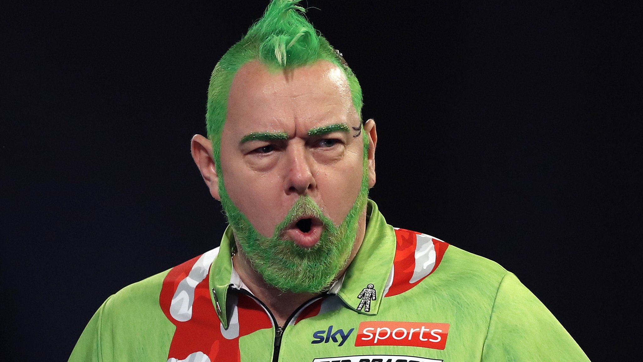 PDC World Darts Championship: Peter Wright wins opener in Grinch get-up