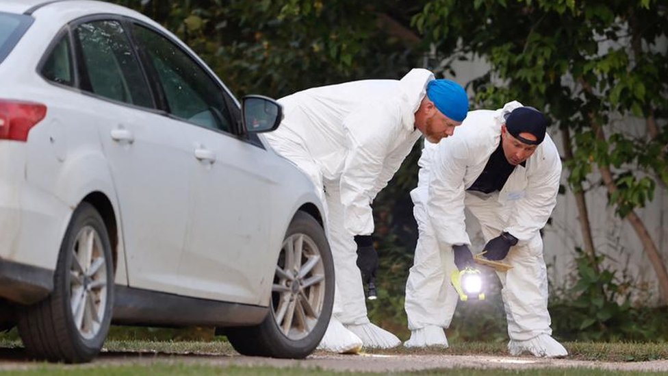 A police forensics team investigates a crime scene after multiple people were killed and injured in a stabbing spree in Weldon, Saskatchewan, Canada. September 4