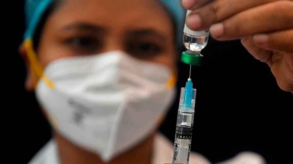 A health worker takes part in a dry run or mock drill for the Covid-19 coronavirus vaccine delivery held at SSKM hospital in Kolkata on January 8, 2021