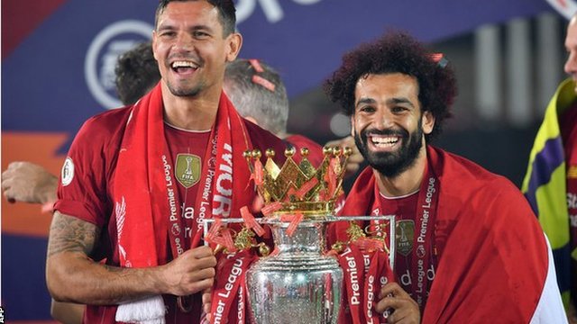 Liverpool's Mohamed Salah (right) celebrates with defender Dejan Lovren