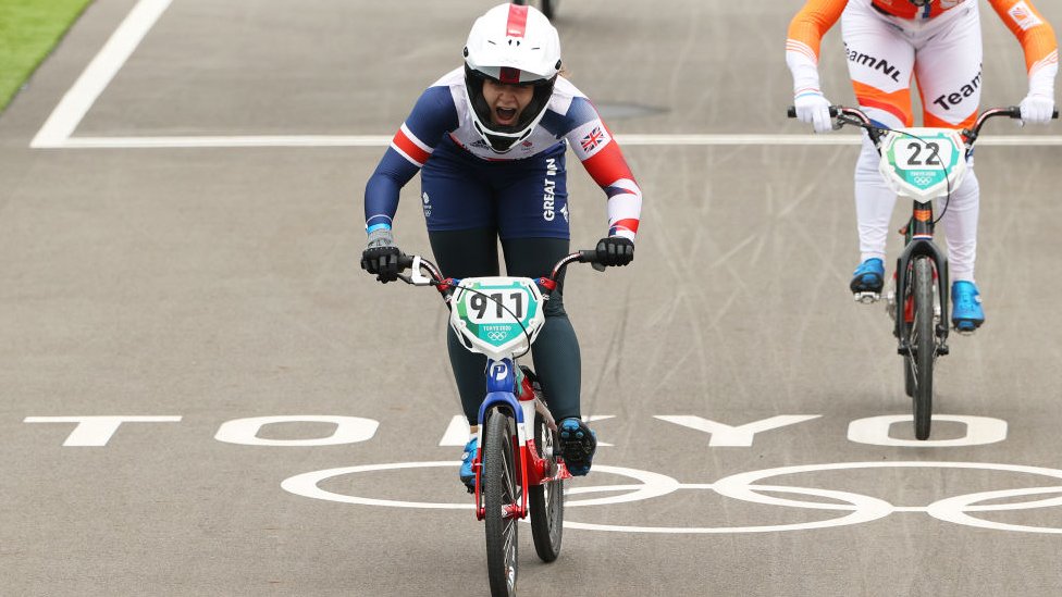Bethany Shriever celebrates winning a BMX race at the Olympics