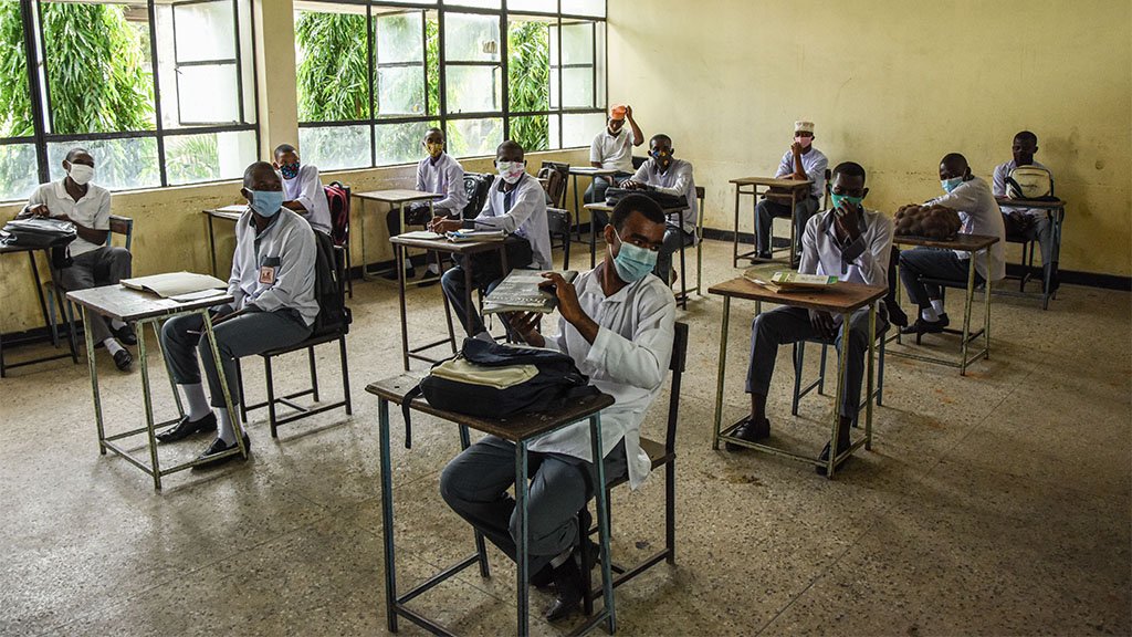 Students of Al-Haramain secondary school wait for their class to start as they attend their first day of re-opened school in Dar es Salaam, Tanzania, on June 1, 2020.