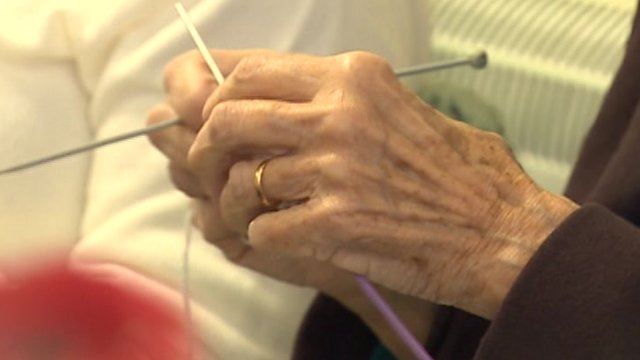 Elderly hands knitting