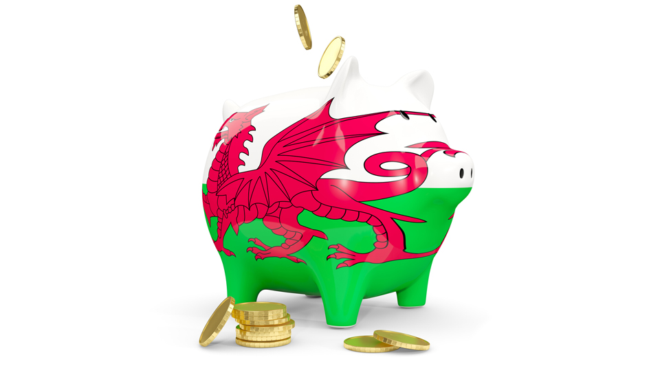 Wales' flag on a piggy bank