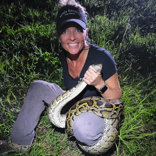 Amy Siewe holding a python