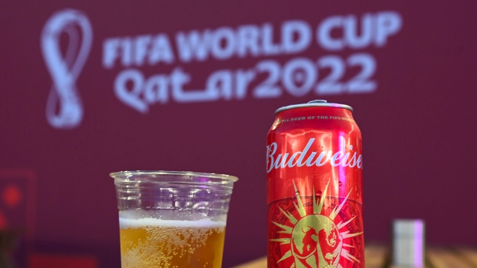 A Budweiser in front of a Qatar World Cup logo