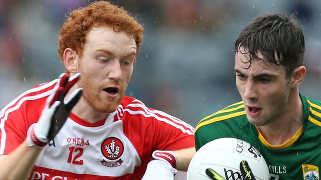 Conor Glass of Tyrone in action against Daniel O'Brien of Kerry