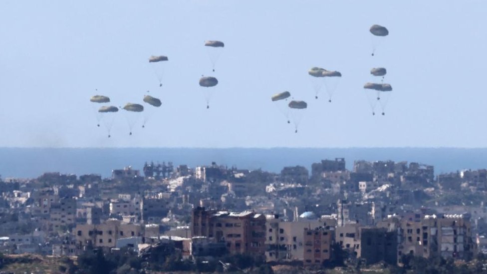 Israel Gaza: BBC goes onboard plane dropping US aid into war zone