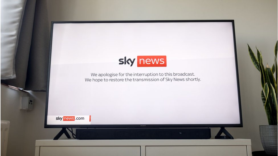 In this photo illustration a television screen displays a Sky News announcement of an interruption to this broadcast as the channel is off air due to an IT outage on July 19, 2024 in London, United Kingdom