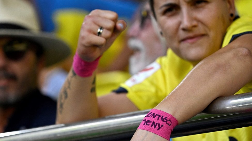 A football fan wears a wristband in support of Jenni Hermoso at a La Liga match between Villarreal CF and FC Barcelona