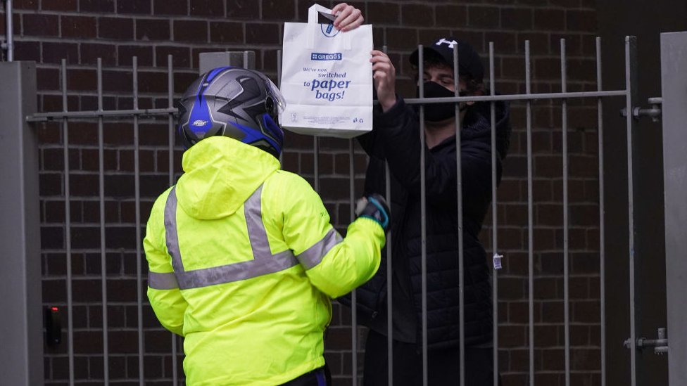 Student receiving a takeaway in their halls of residence