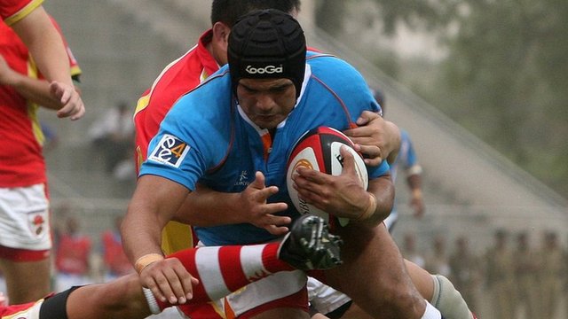 India score a try in a rugby sevens game against China