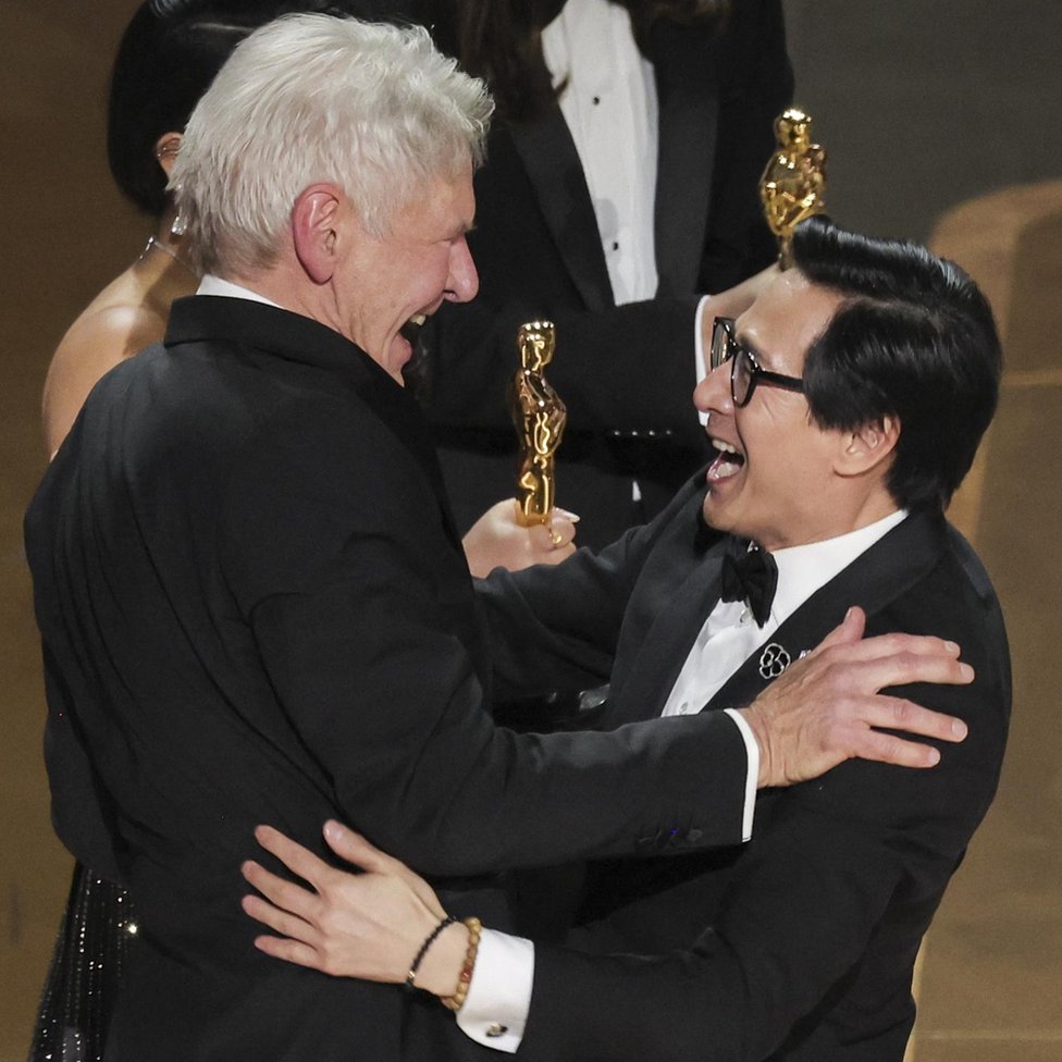 Ke Huy Quan receives the Oscar for Best supporting actor from Harrison Ford after "Everything Everywhere All at Once" won during the Oscars show at the 95th Academy Awards in Hollywood, Los Angeles, California, U.S., March 12, 2023