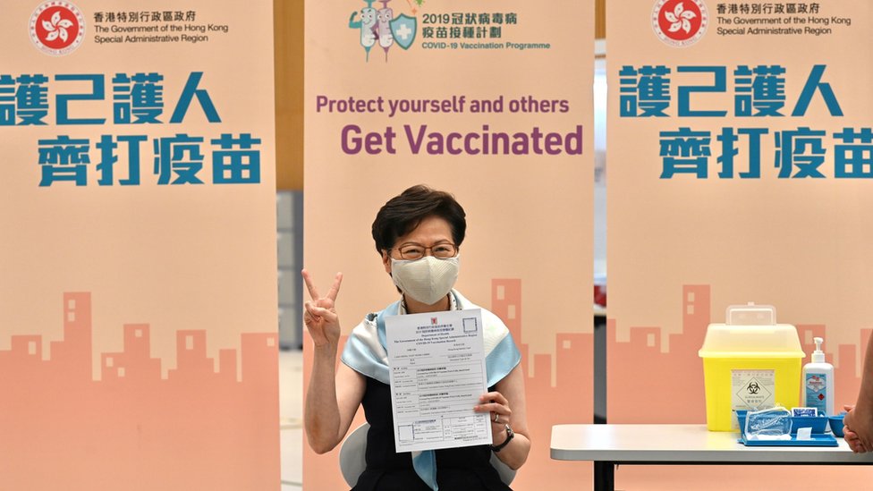 Hong Kong Chief Executive Carrie Lam poses with her vaccination record after receiving a second dose of the Sinovac Biotech vaccine against coronavirus disease (COVID-19),