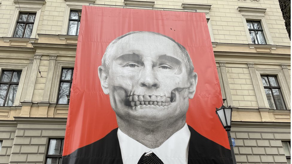 Banner of Russian President Vladimir Putin with 'death mask' on his face, next to the Moscow embassy in Riga, Latvia
