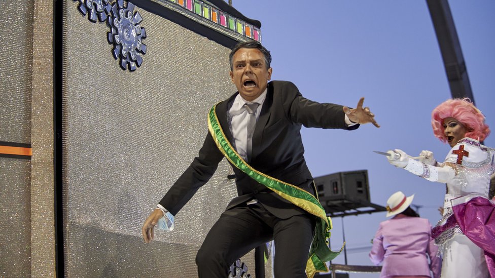 Samba performer depicting President Bolsonaro