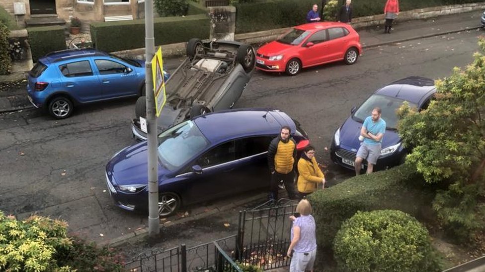 Car flips onto roof in residential street in Glasgow BBC News