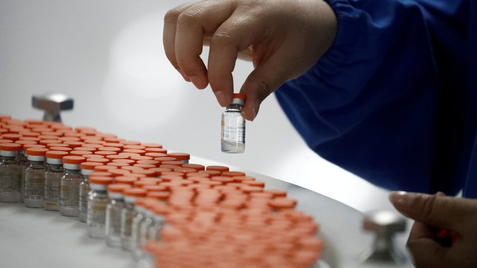 A worker performs a quality check in the packaging facility of Chinese vaccine maker Sinovac Biotech in September 2020