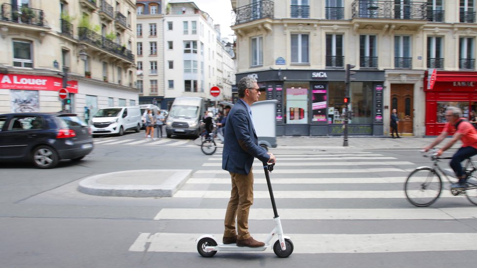 A man rides an electric scooter in Paris on 17 June 2019