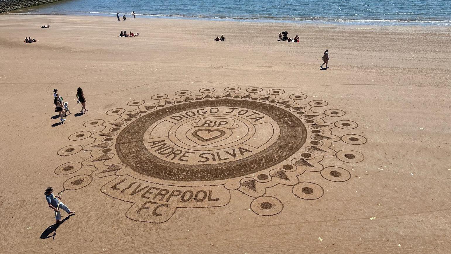 Sand tribute to Diogo Jota and Andre Silva on Torquay beach