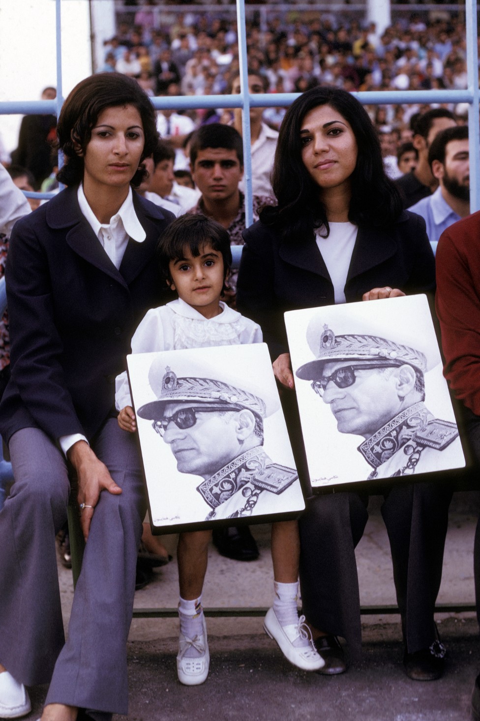 Attendees at a celebration of the birthday of the Shah of Iran in a stadium in the 1970s