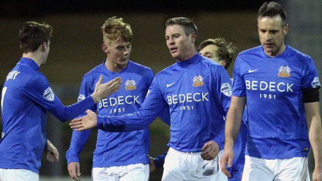 Glenavon players celebrate a 5-1 victory over Carrick Rangers