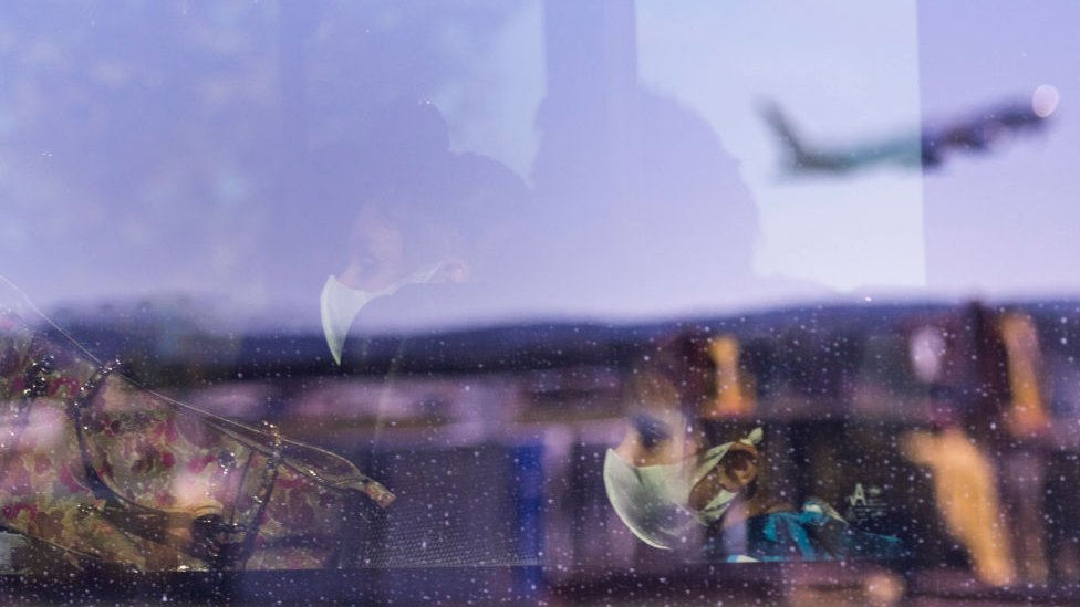 Passengers on a bus are seen after flying in from Delhi on May 15, 2020 in Canberra, Australia.