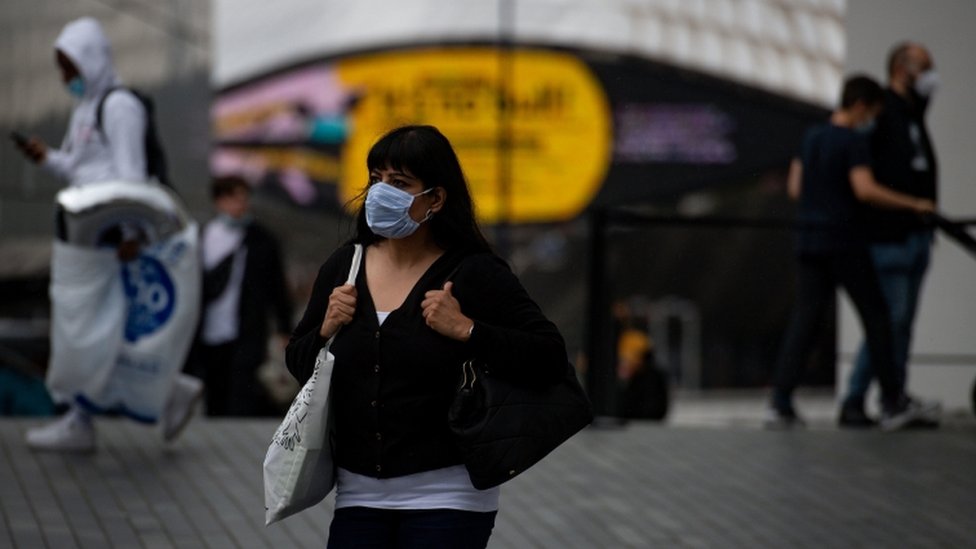 A woman with a mask in Birmingham city center