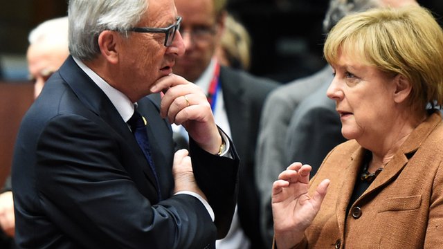 European Commission president Jean-Claude Juncker (l) and German chancellor Angela Merkel (r) talking prior to a meeting of EU leaders on Europe migrant crisis