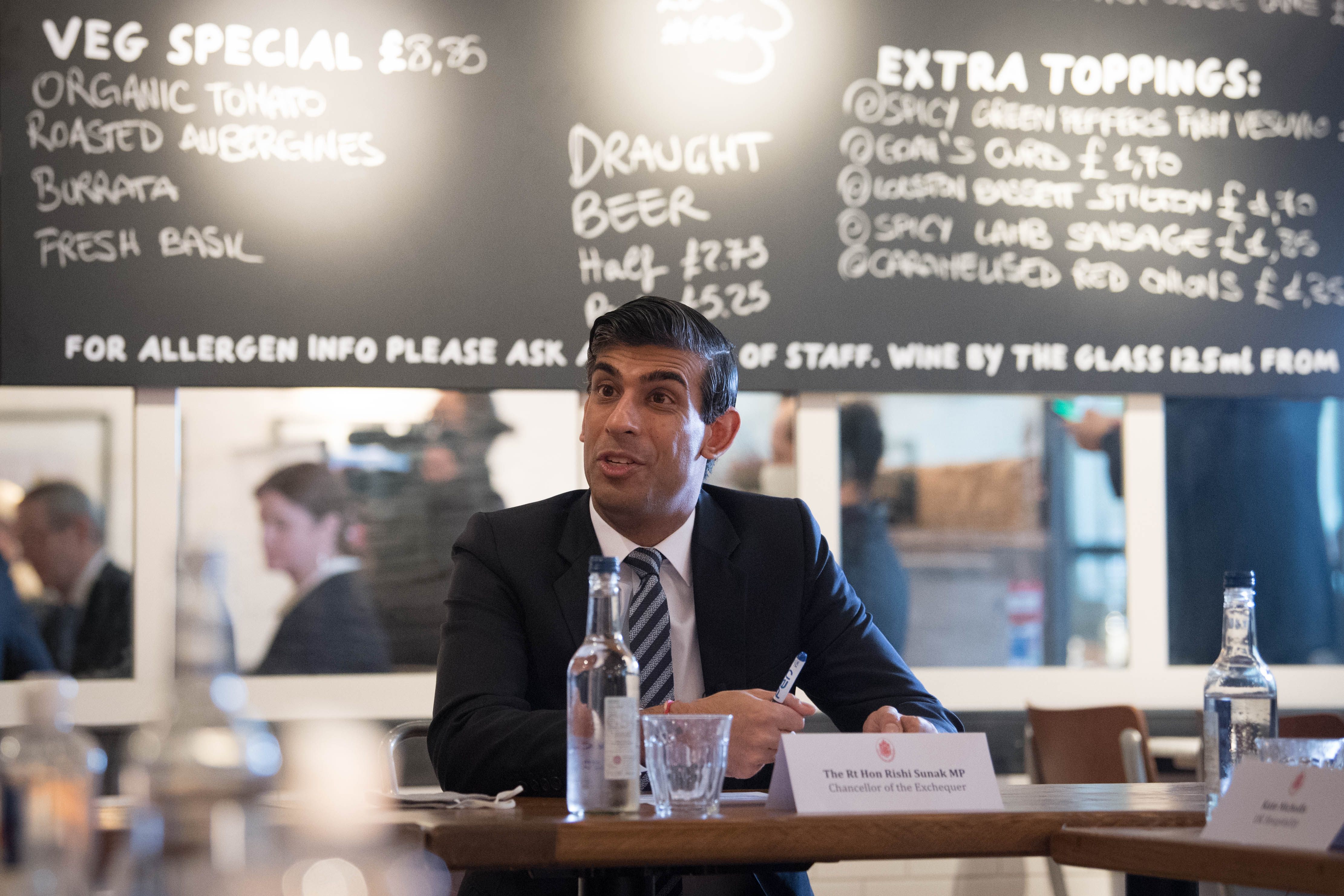 UK Chancellor Rishi Sunak hosts a meeting at a pizza restaurant in October