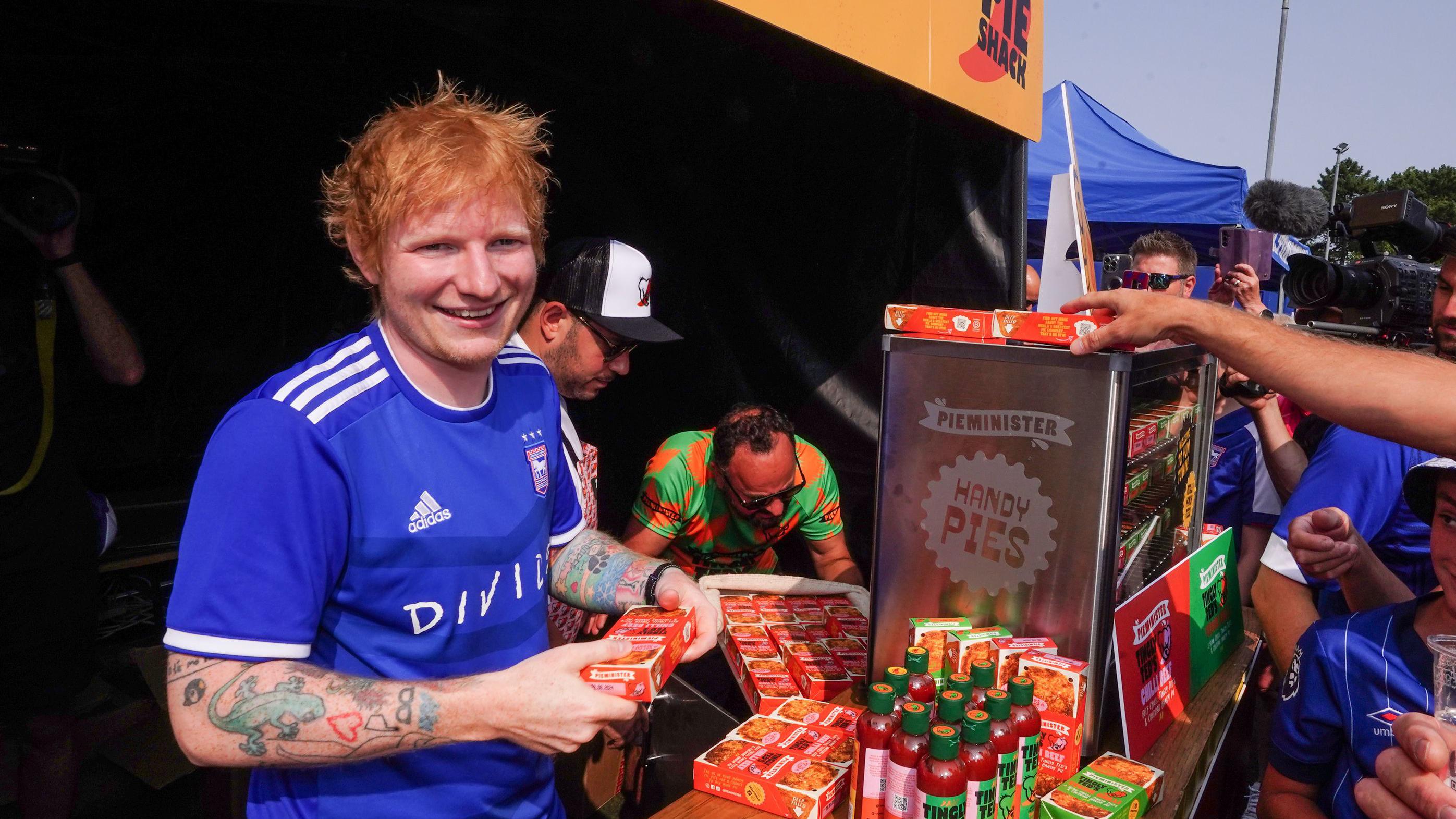 Ed Sheeran hands out pies to Ipswich Town fans